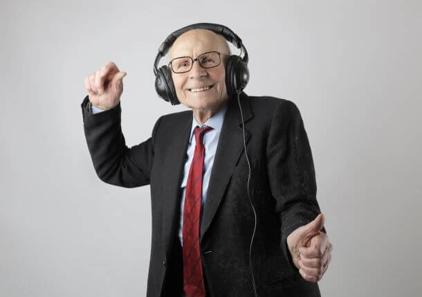 Old man dancing with headphones on